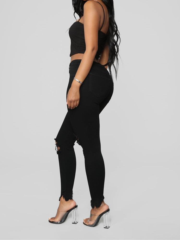 Zerrissene, einfarbige lange Jeanshose