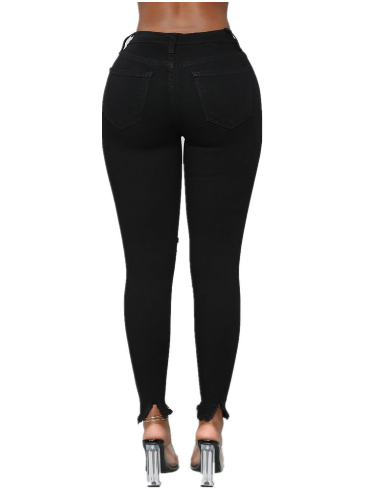 Zerrissene, einfarbige lange Jeanshose